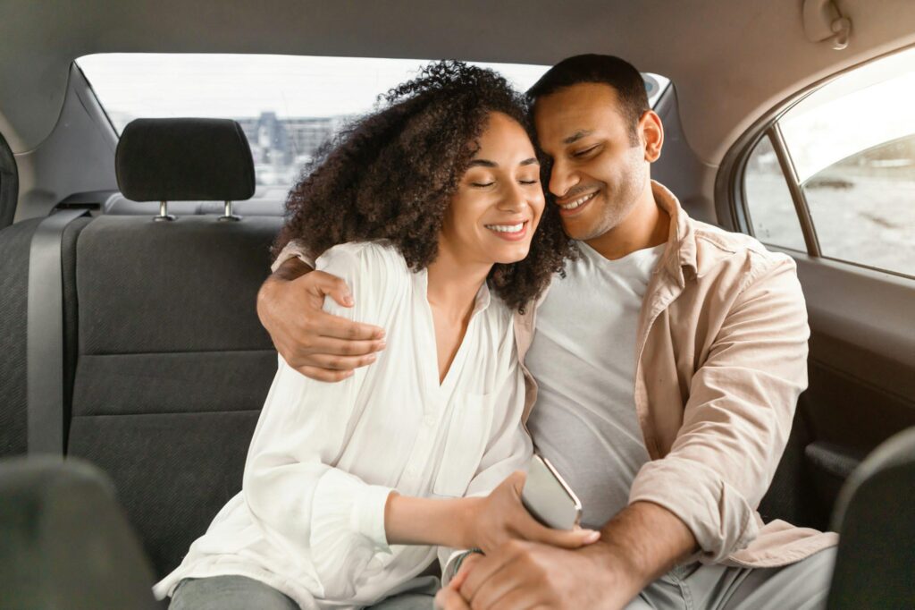 loving-arabic-couple-embracing-sitting-in-backseat-of-luxury-automobile.jpg